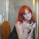 A pretty Scottish girl with red hair takes a piss and shit while sitting on a toilet and looking at her cell phone. She adds a deodorant to the toilet water before plops are heard at 2:27 into the clip. Over 5 minutes.